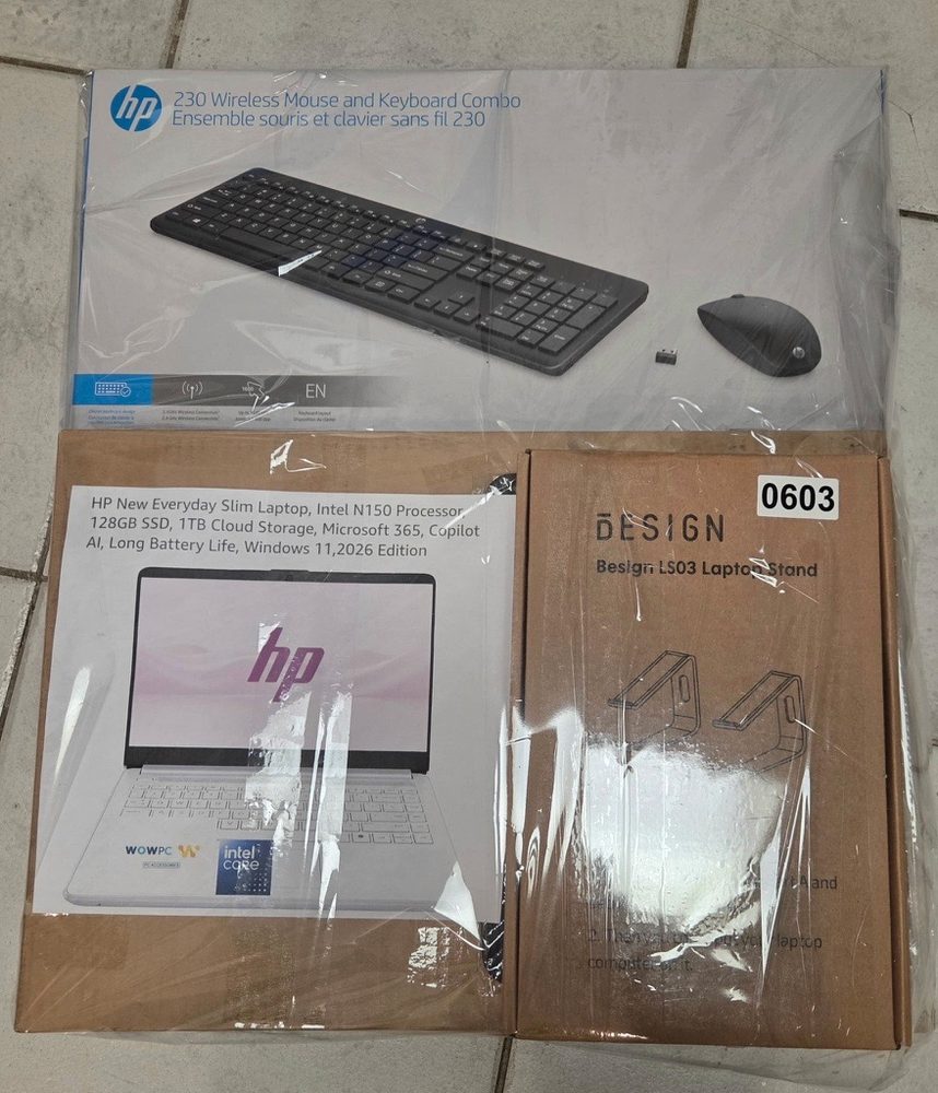 HP Everyday Slim laptop with wireless keyboard and mouse combo and a laptop stand