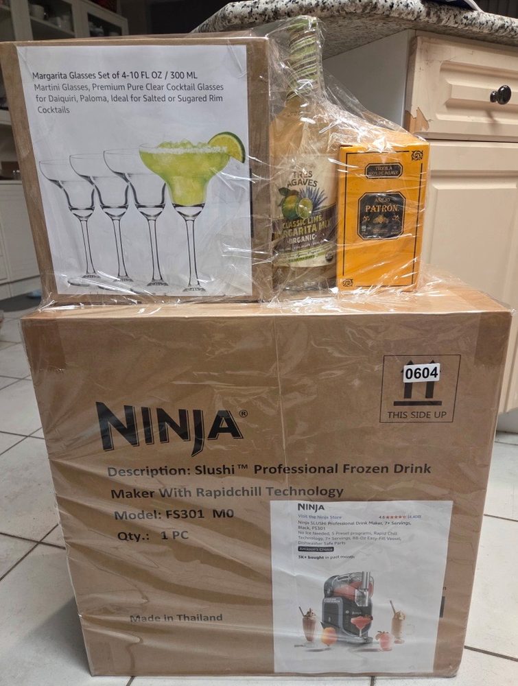 Ninja Slushi professional frozen drink maker with margarita glasses and mixers